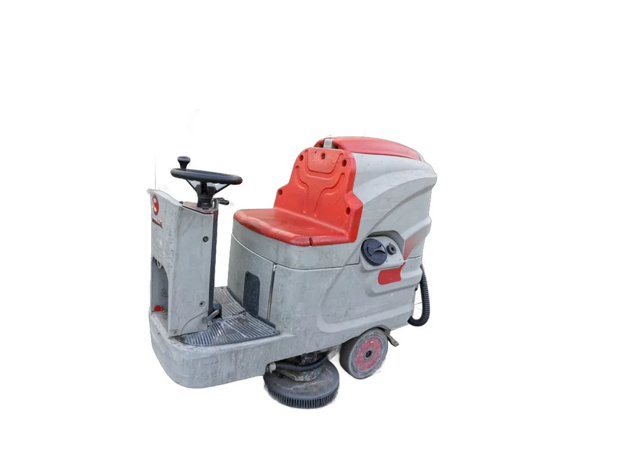 A ride-on floor cleaning machine with a seat, a steering wheel and a disc brush head, photographed against a white background.